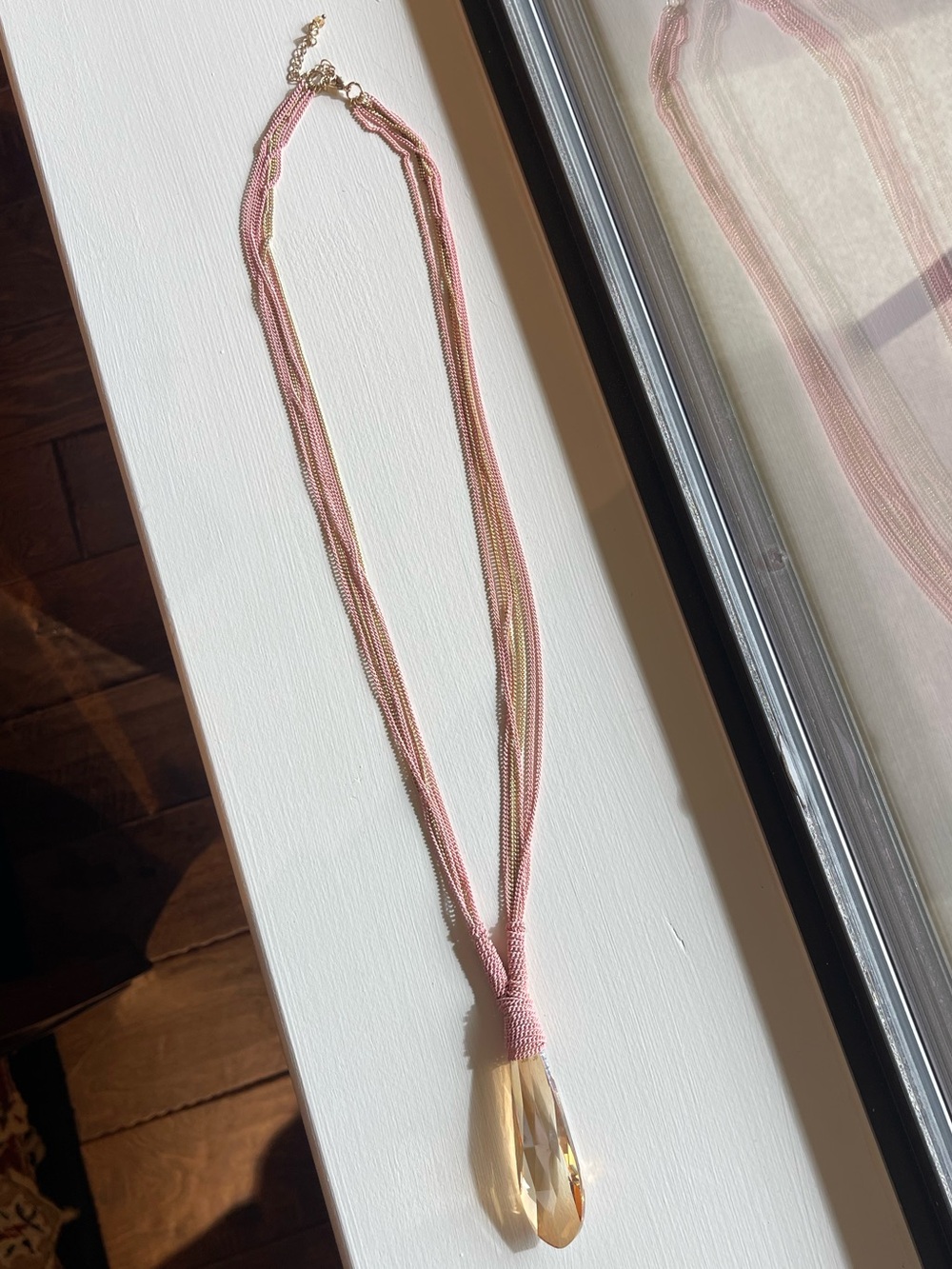 Multiple chain necklace with heavy iridescent prism